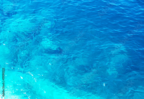 Soft blurred texture of blue water © modusviv