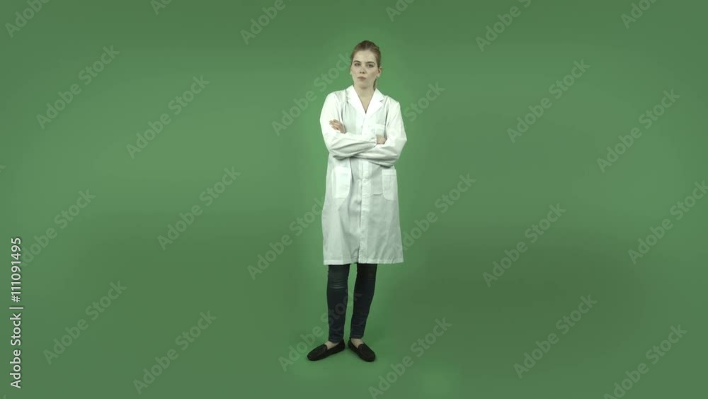 attractive caucasian girl with lab coat isolated on green upset attractive caucasian girl with lab coat isolated on green upset