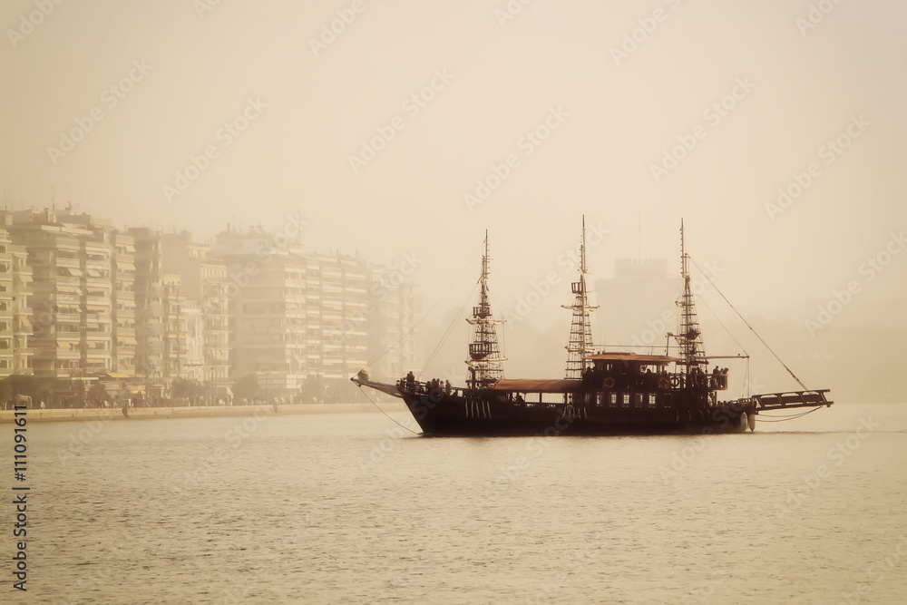 Fototapeta antique ship in the port of Thessaloniki a day with fog