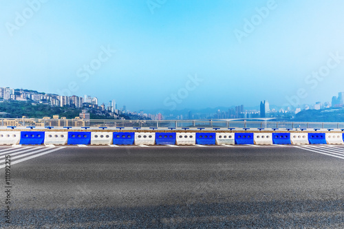 clean highway,with cityscape background © kalafoto