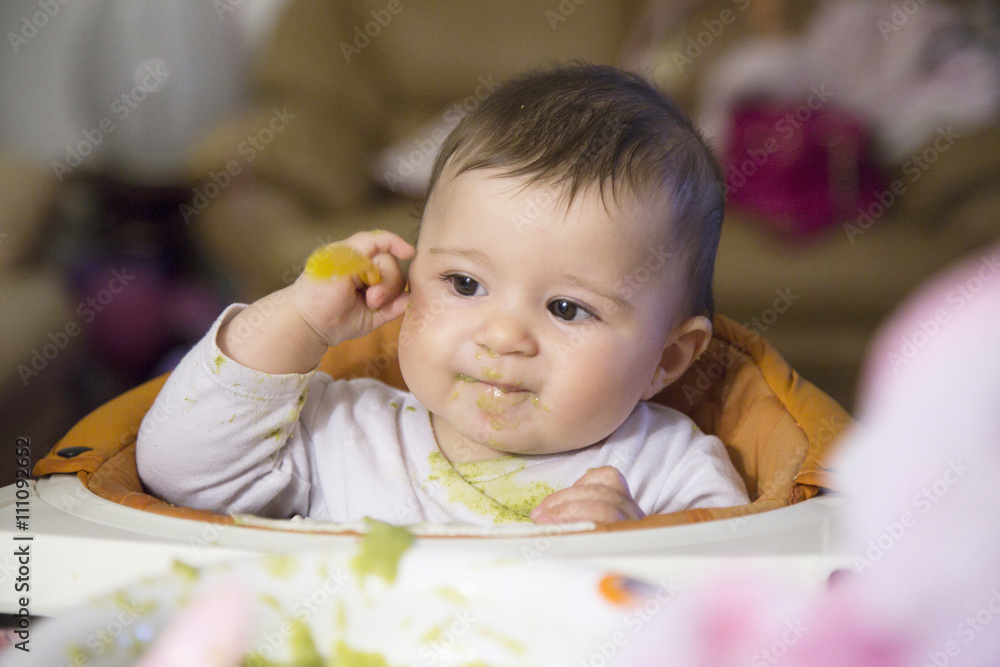 Fototapeta premium Smiling lovely baby with spoon