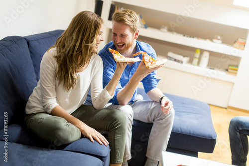 Couple eating pizza