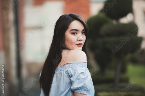 Young Asians girl with modern dress posing in an old Krakow Free Download Young Asians girl with modern dress posing in an old Krakow - GFXLoad