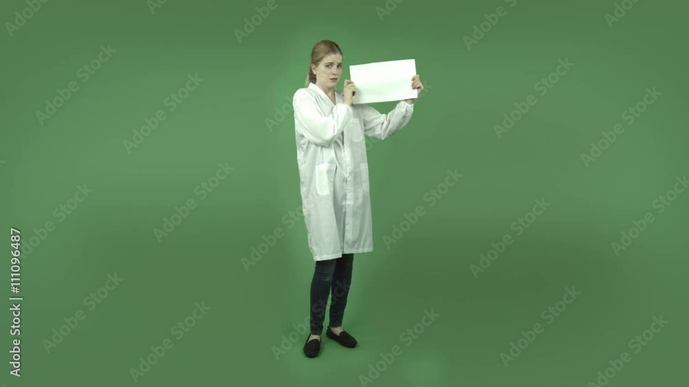 attractive caucasian girl with lab coat isolated on green worried with blank sign attractive caucasian girl with lab coat isolated on green worried with blank sign