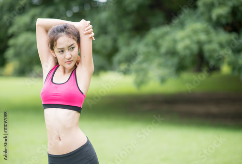 beautiful asian woman exercising in the park