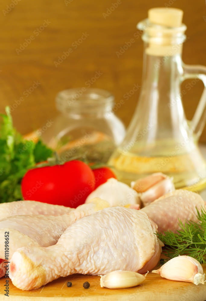 Raw chicken with vegetables and spices before cooking Raw chicken with vegetables and spices before cooking
