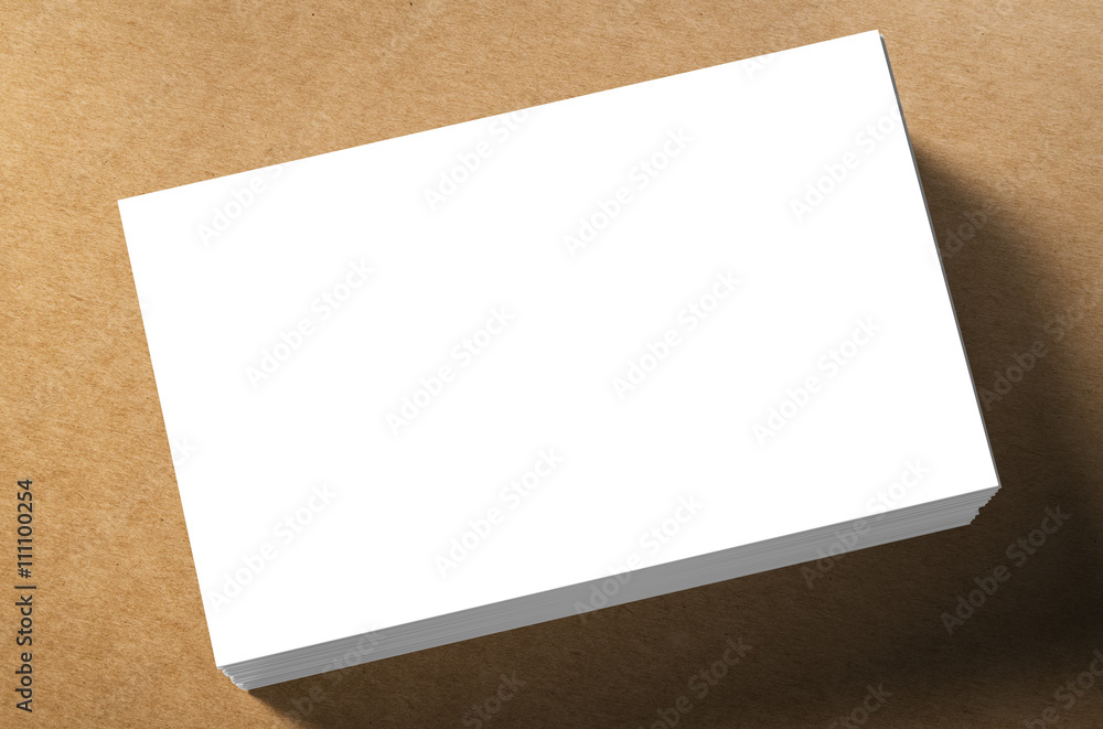 stack of white blank name card on brown background