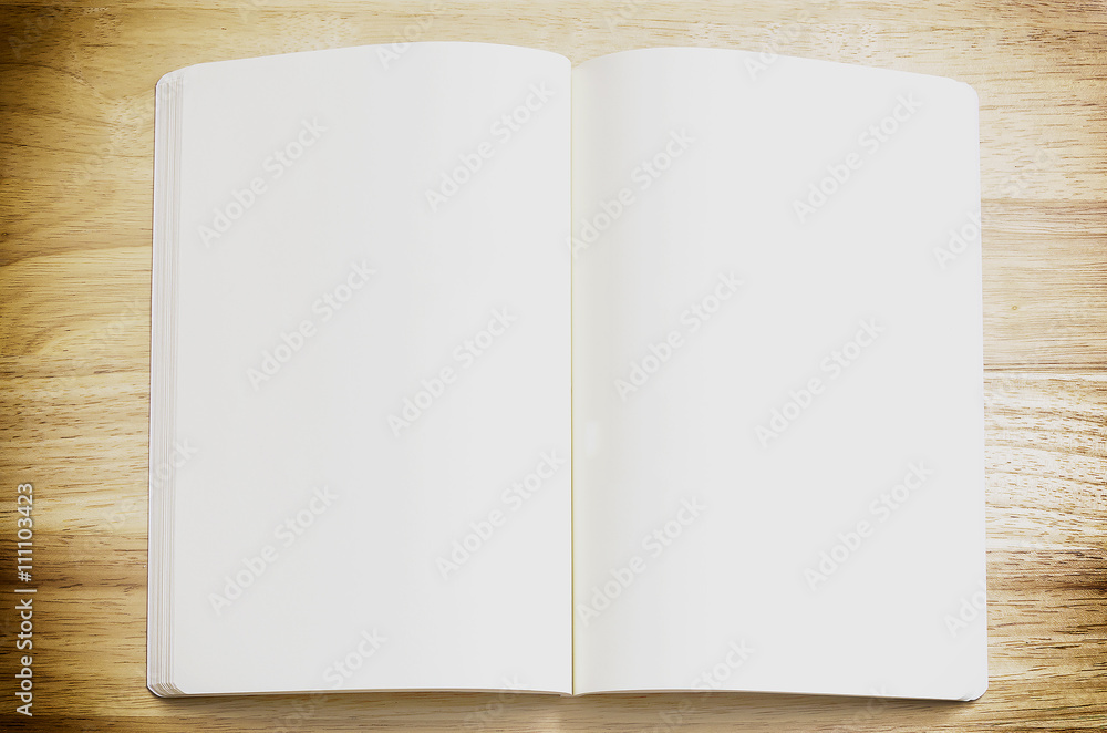 Opened notebook on wooden background Opened notebook on wooden background