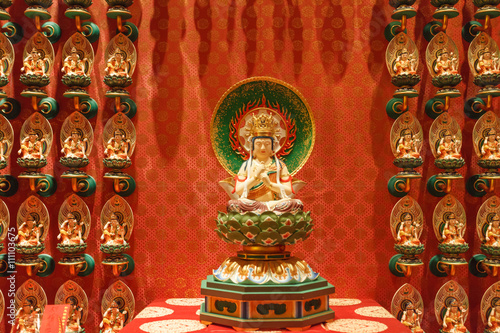 SINGAPORE/SINGAPORE - 27 MAR, 2014 : Red Chinese temple, Buddha
