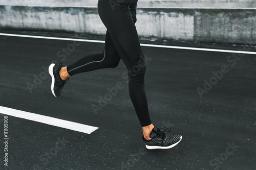 Sport. Close Up Of Sporty Male Legs In Sportwear And Sneakers Running On Road. Healthy Active Athletic Runner Man Jogging During Outdoor Workout, Exercising And Training For Marathon. Fitness Concept