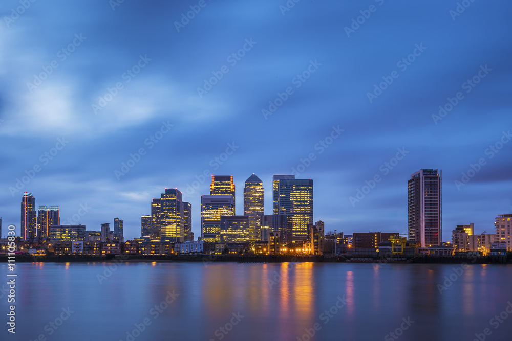 London, UK - Canary Wharf, the famous business district and skyscrapers of London at blue hour
