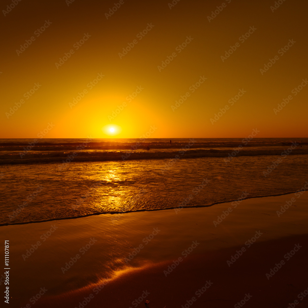 Evening sunset painted waves of ocean surf. Beach in San Diego, California. Long exposure. Evening sunset painted waves of ocean surf. Beach in San Diego, California. Long exposure.