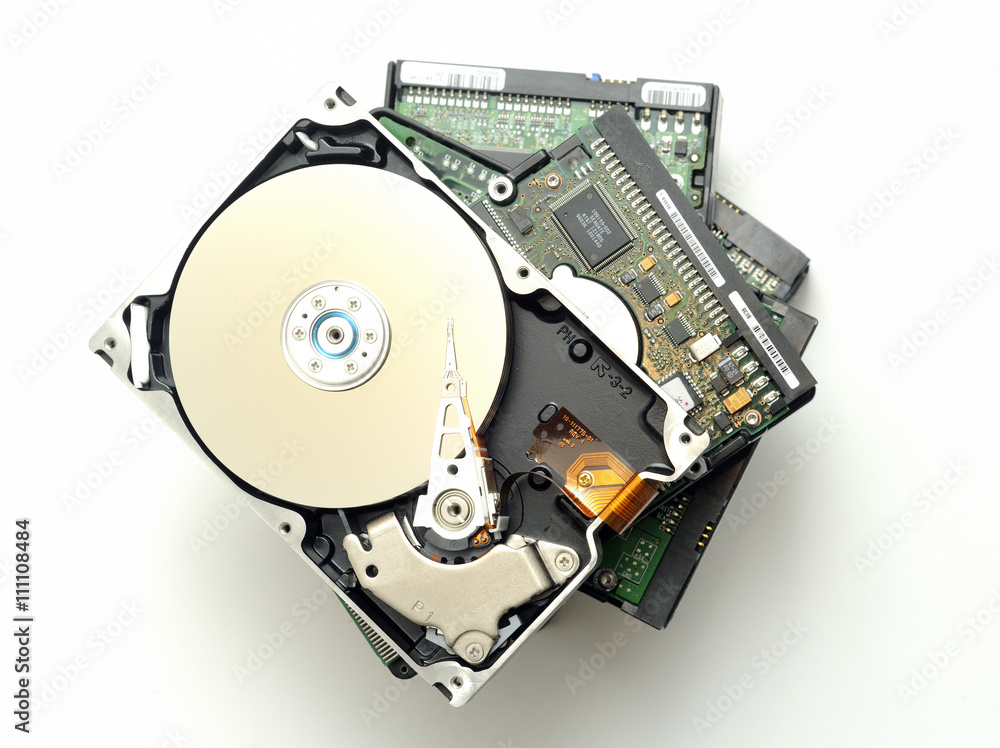 Stack of hard disk drives. Closeup with with shallow DOF. Isolated on white background. Stack of hard disk drives. Closeup with with shallow DOF. Isolated on white background.