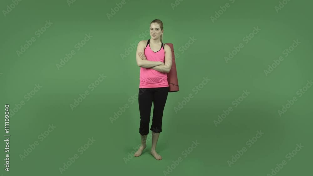 attractive caucasian sporty girl isolated on green confident smiling attractive caucasian sporty girl isolated on green confident smiling