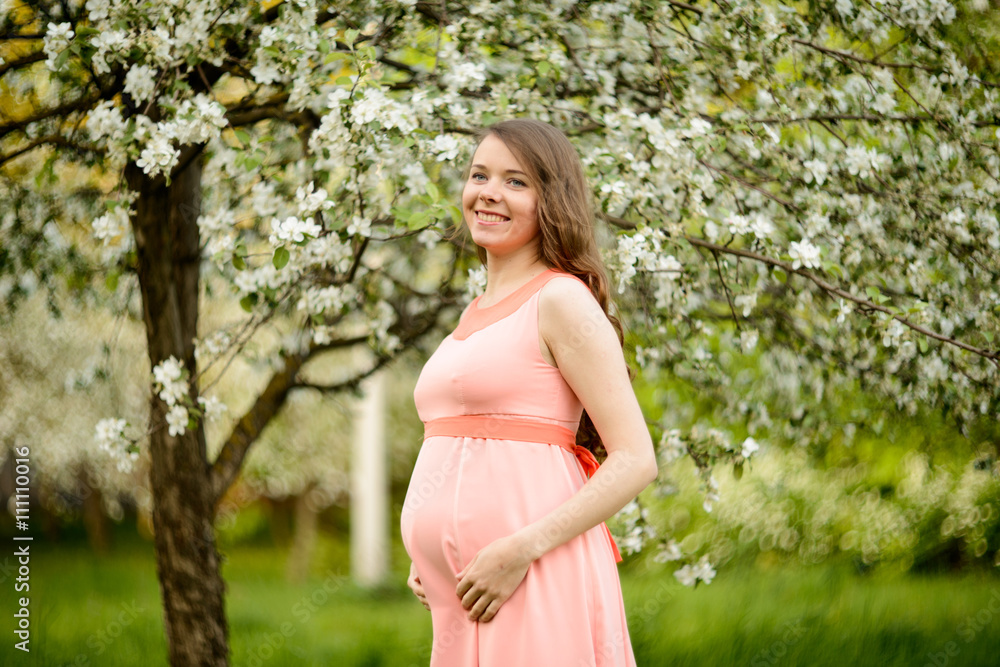 Couple in love under blooming branches spring day. Couple in love under blooming branches spring day.