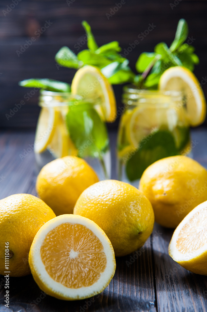 lemons on a dark wooden table, lemonade background. selective focus lemons on a dark wooden table, lemonade background. selective focus