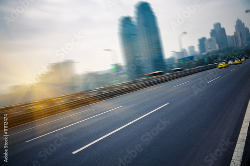 motion traffic on highway wity city background   chongqing china.
