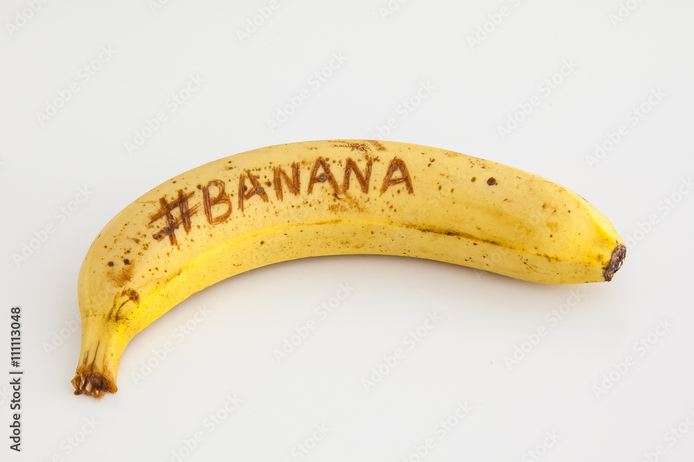 Banana with white background and text on fruit Banana with white background and text on fruit