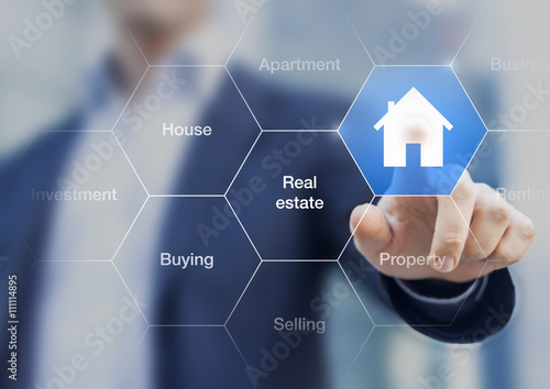 Real estate agent pushing a button with a house