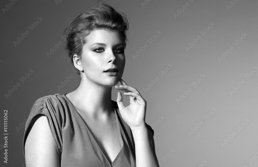 Obraz premium Portrait of beautiful plump girl in a green evening dress and ha