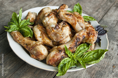Fried chicken legs with basil