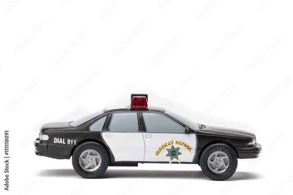 Fototapeta premium miniature police car on white background