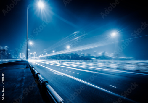 traffic trails on bridge,chongqing china,blue toned image.