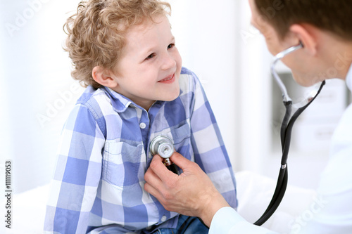 Doctor examining a child patient by stethoscope