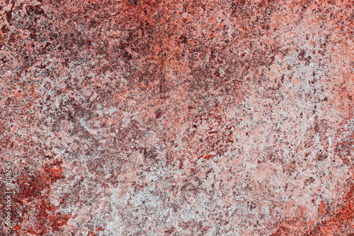 close up of old stone with red crust