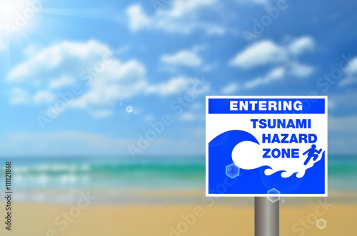 Tsunami sign on blur tropical beach abstract