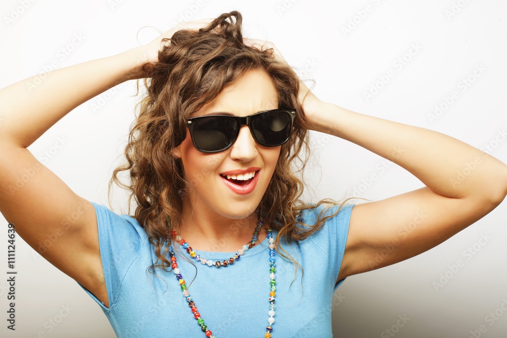 funny girl in sunglasses with expression of surprise funny girl in sunglasses with expression of surprise