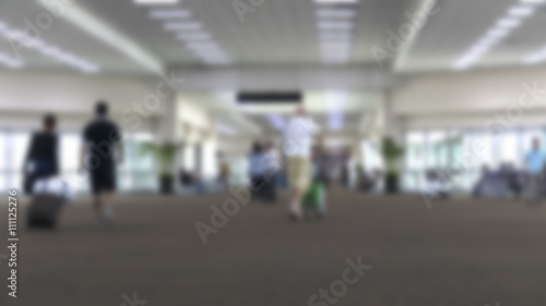 people in airport terminal, blur background
