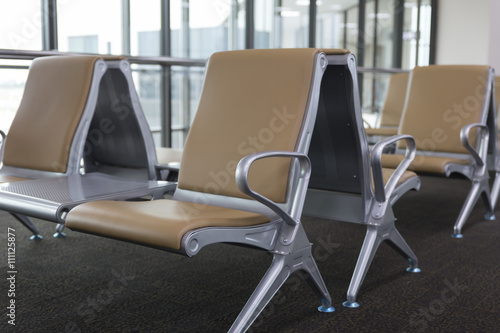 brown leather chair in airport terminal © 88studio