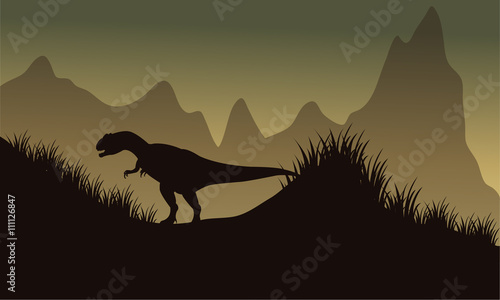 Silhouette of allosaurus in park