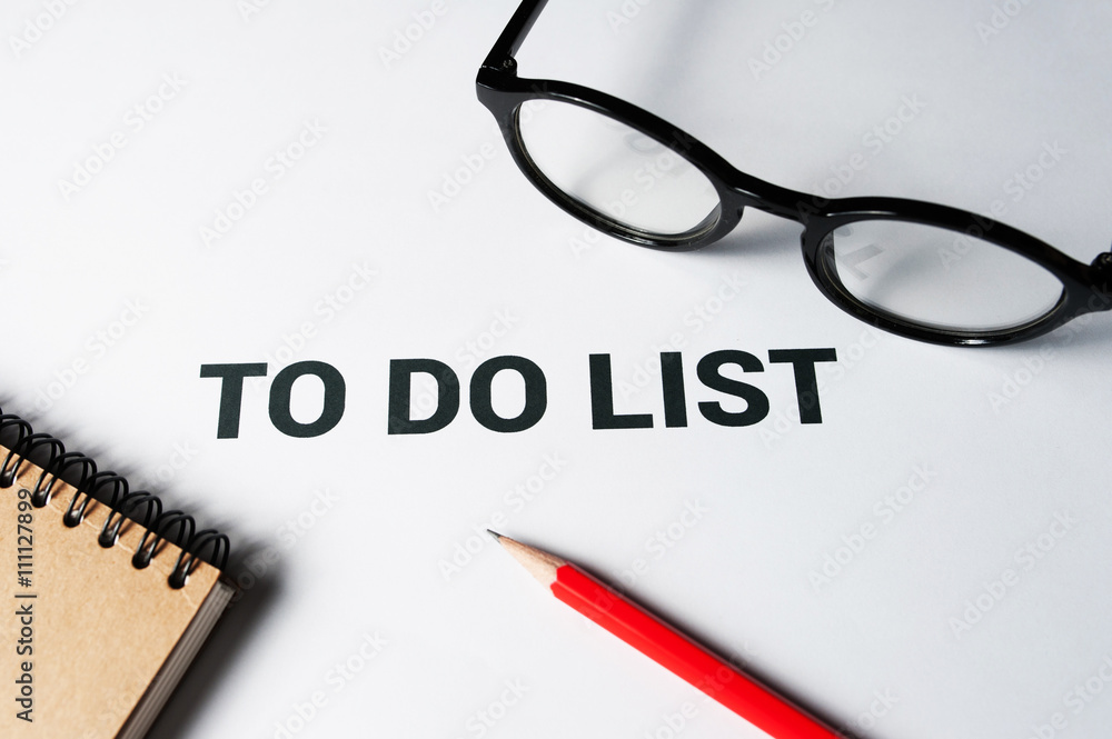 To do list words on paper with office supplies To do list words on paper with office supplies