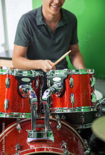 Drummer Performing In Recording Studio