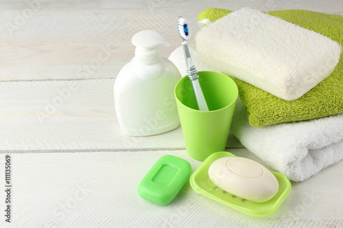 personal hygiene products on white wooden background
