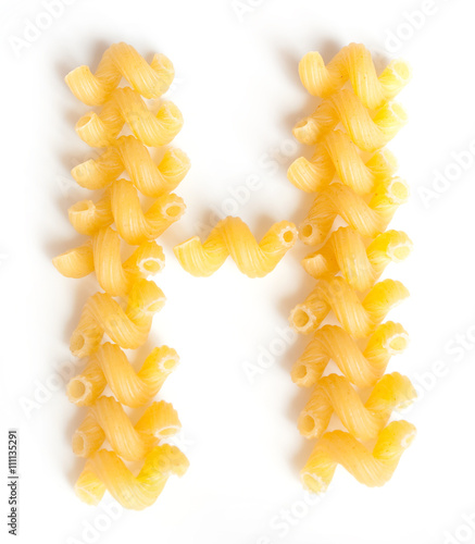 Letter H made from macaroni under a daylight isolated on white background