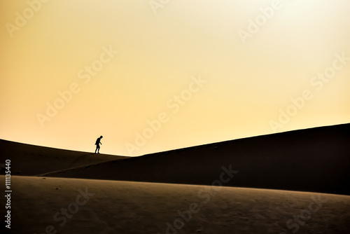 Men walking in the desert of gran canaria  spain