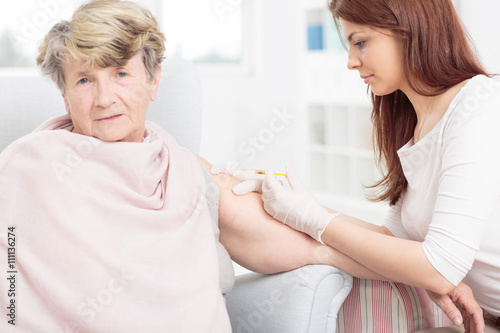 Senior woman and her caring grandchild