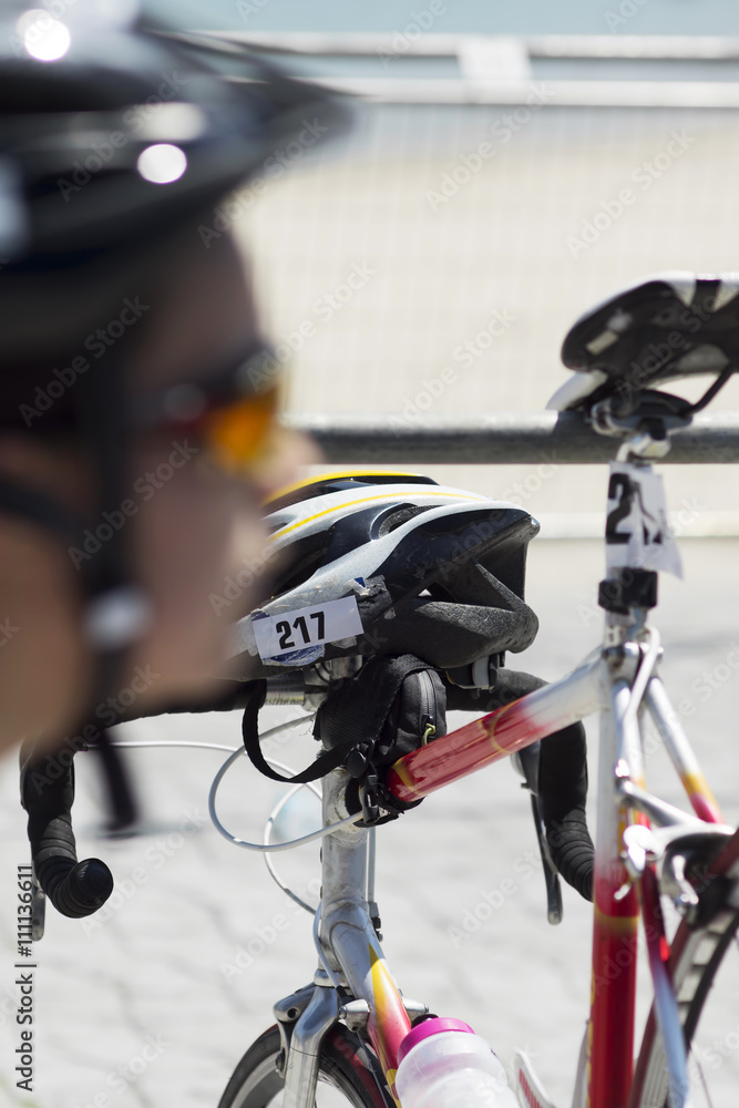 triatlheta preparing the bikes for the race triatlheta preparing the bikes for the race