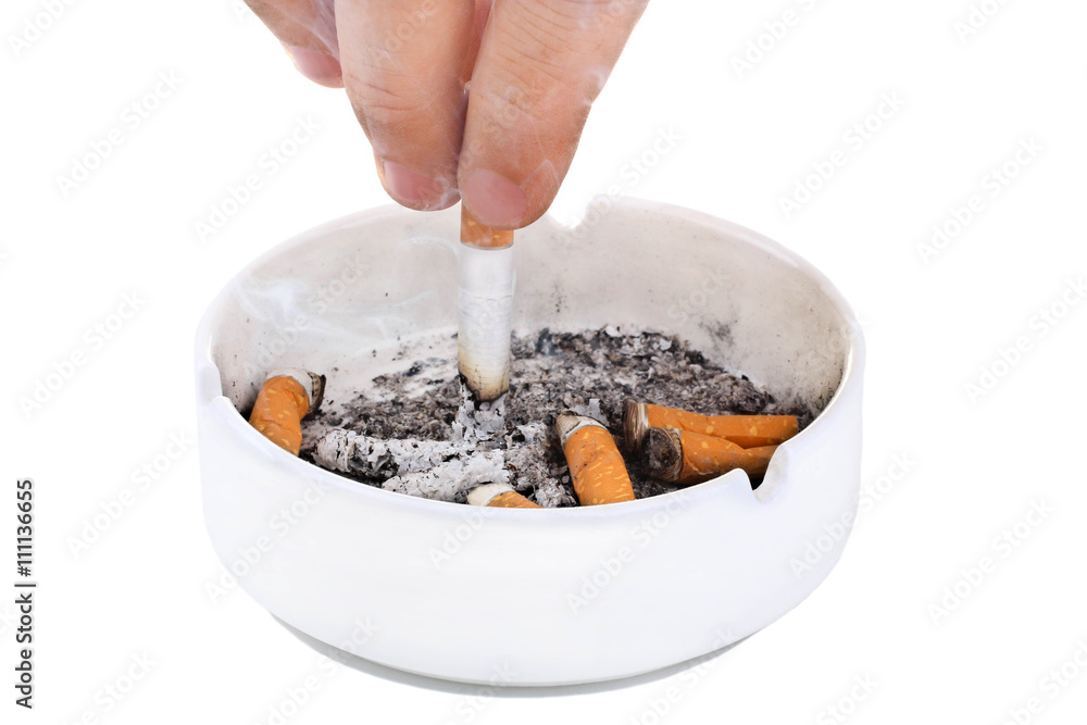 man strusevich the ashes from the cigarette with an orange filter in the ashtray on white isolated background man strusevich the ashes from the cigarette with an orange filter in the ashtray on white isolated background