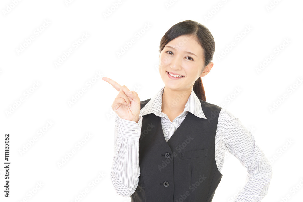 指示する笑顔のビジネスウーマン 指示する笑顔のビジネスウーマン