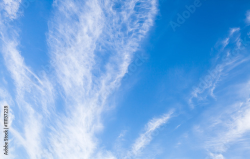 Cirrus clouds in bright blue sky  natural background