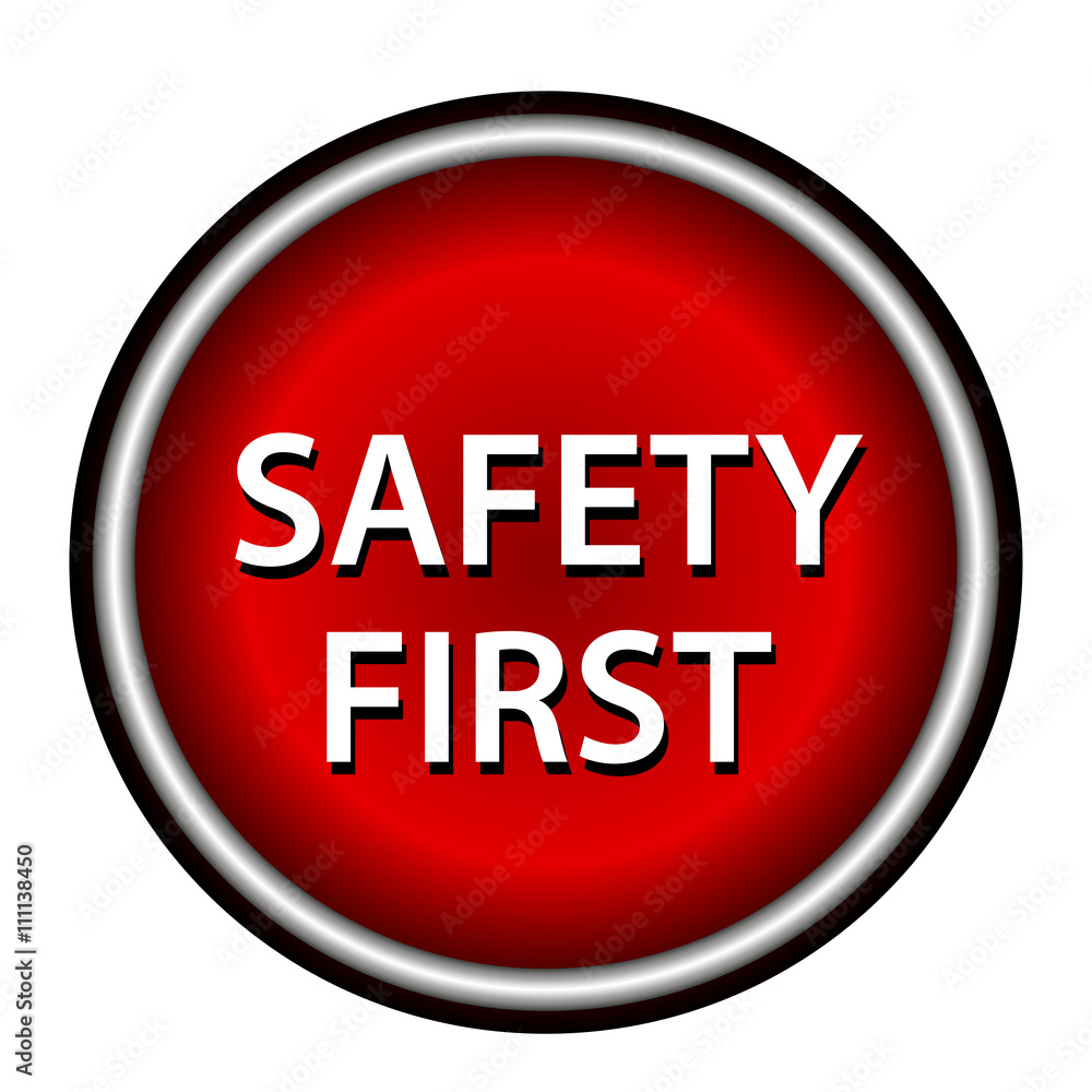 Red round safety first icon with white design on red background Red round safety first icon with white design on red background