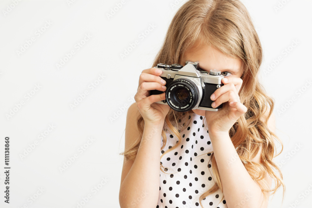Portrait of a lovely little girl with old SLR film camera Portrait of a lovely little girl with old SLR film camera