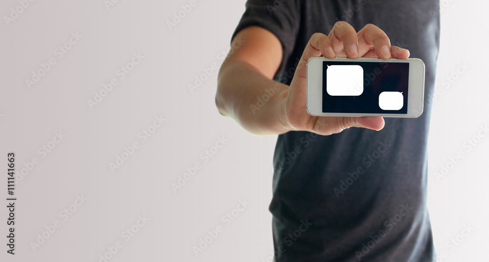 a man using hand holding the smartphone with blank message templ