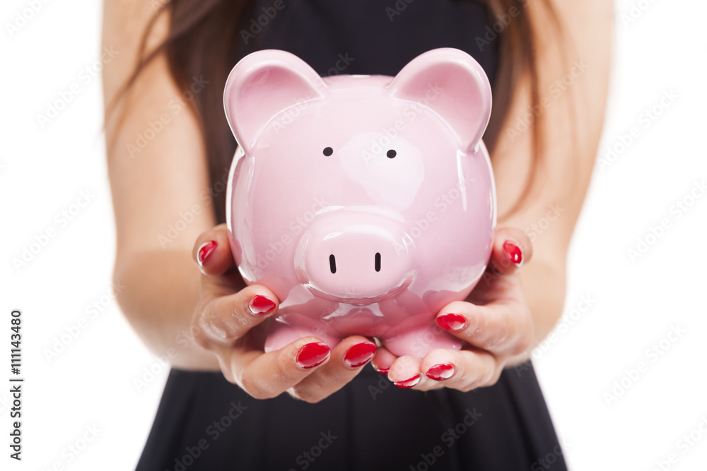 Woman hands holding a piggy bank on white background Woman hands holding a piggy bank on white background