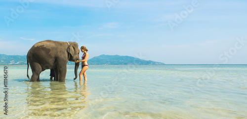 Photography Woman and elephant in the sea. Thailand vacation. Banner.