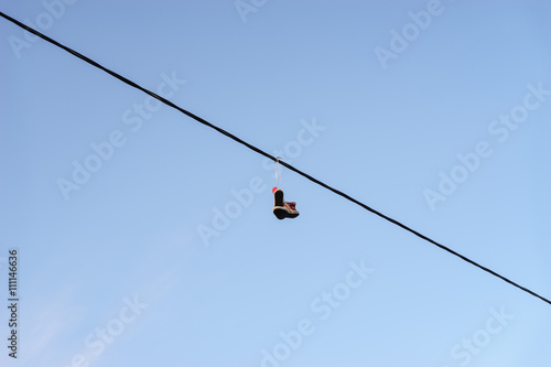 Shoes hanging on telephone wire